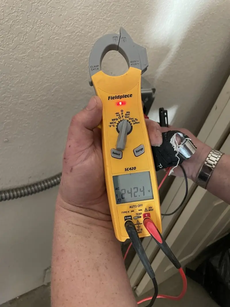 Voltage testing with clamp meter during Recessed Lighting Installation in Midway